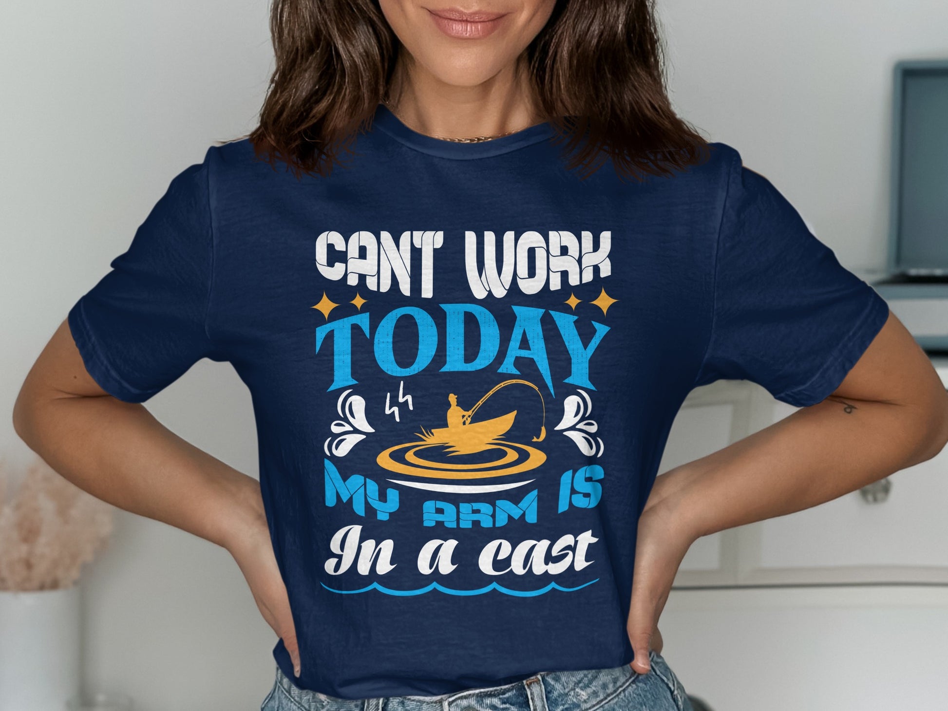 Navy t-shirt with text "CAN'T WORK TODAY MY ARM IS In a cast" and fishing graphic.