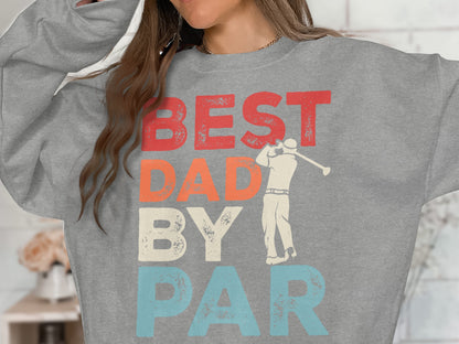Grey sweatshirt with "BEST DAD BY PAR" text and golfer graphic.