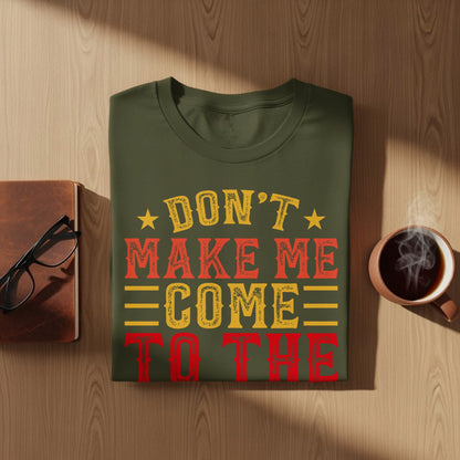 Green t-shirt with "Don't Make Me Come To The" in red and yellow text.