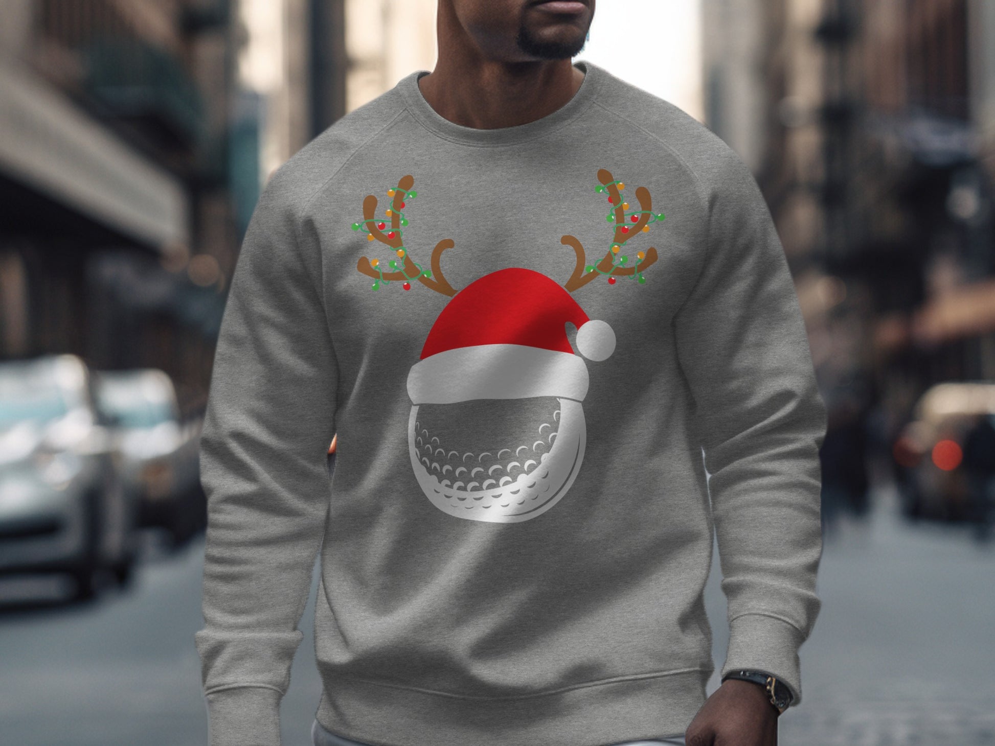 Gray sweatshirt with Christmas-themed golf ball and antlers design.