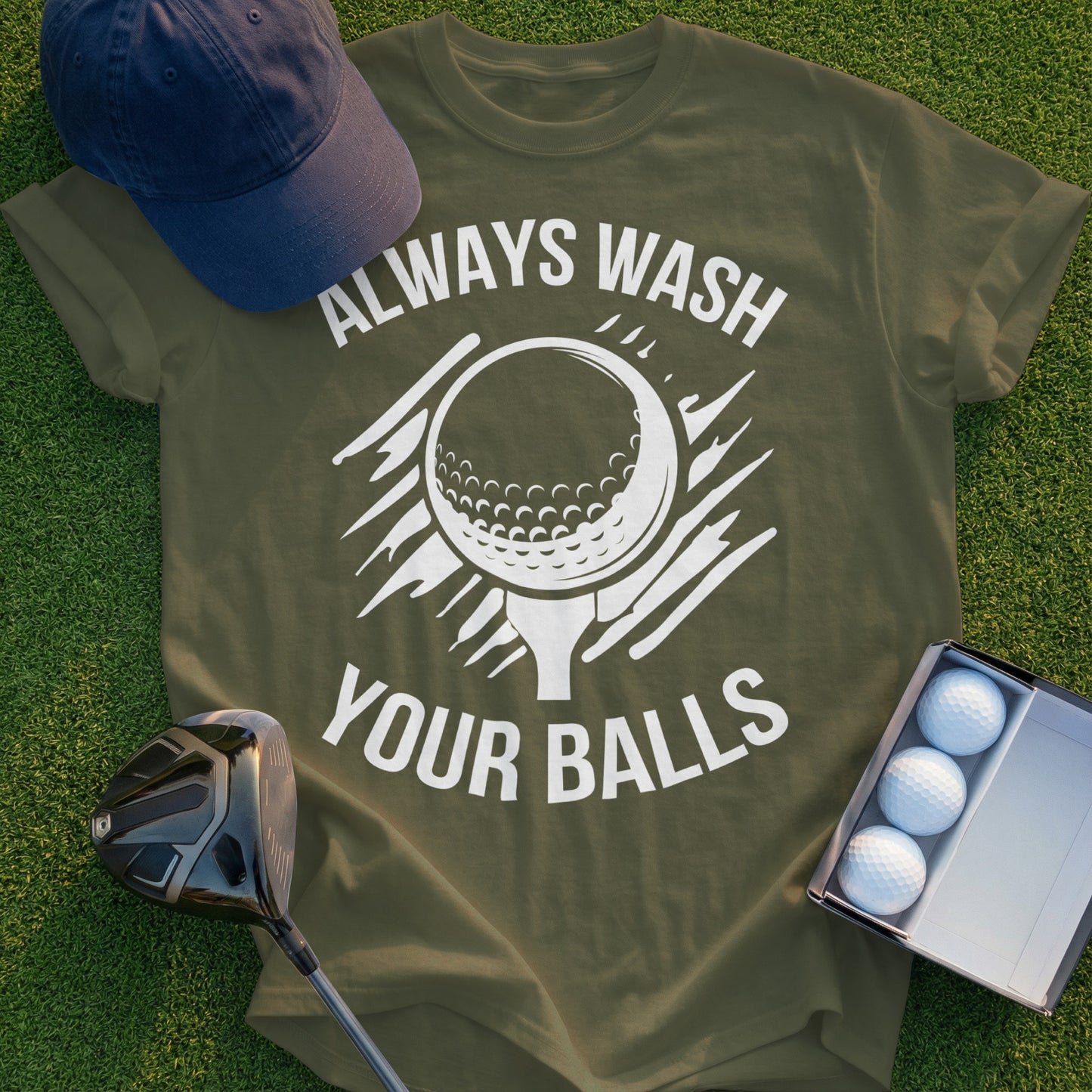 Olive green t-shirt with white text "Always Wash Your Balls" and golf ball graphic.