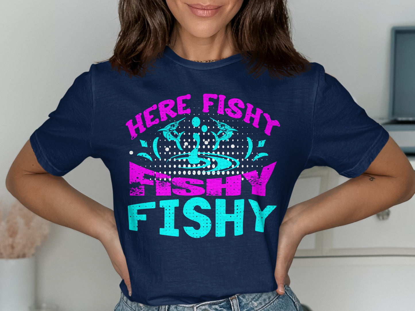 Navy t-shirt with "HERE FISHY FISHY" text in pink and turquoise.