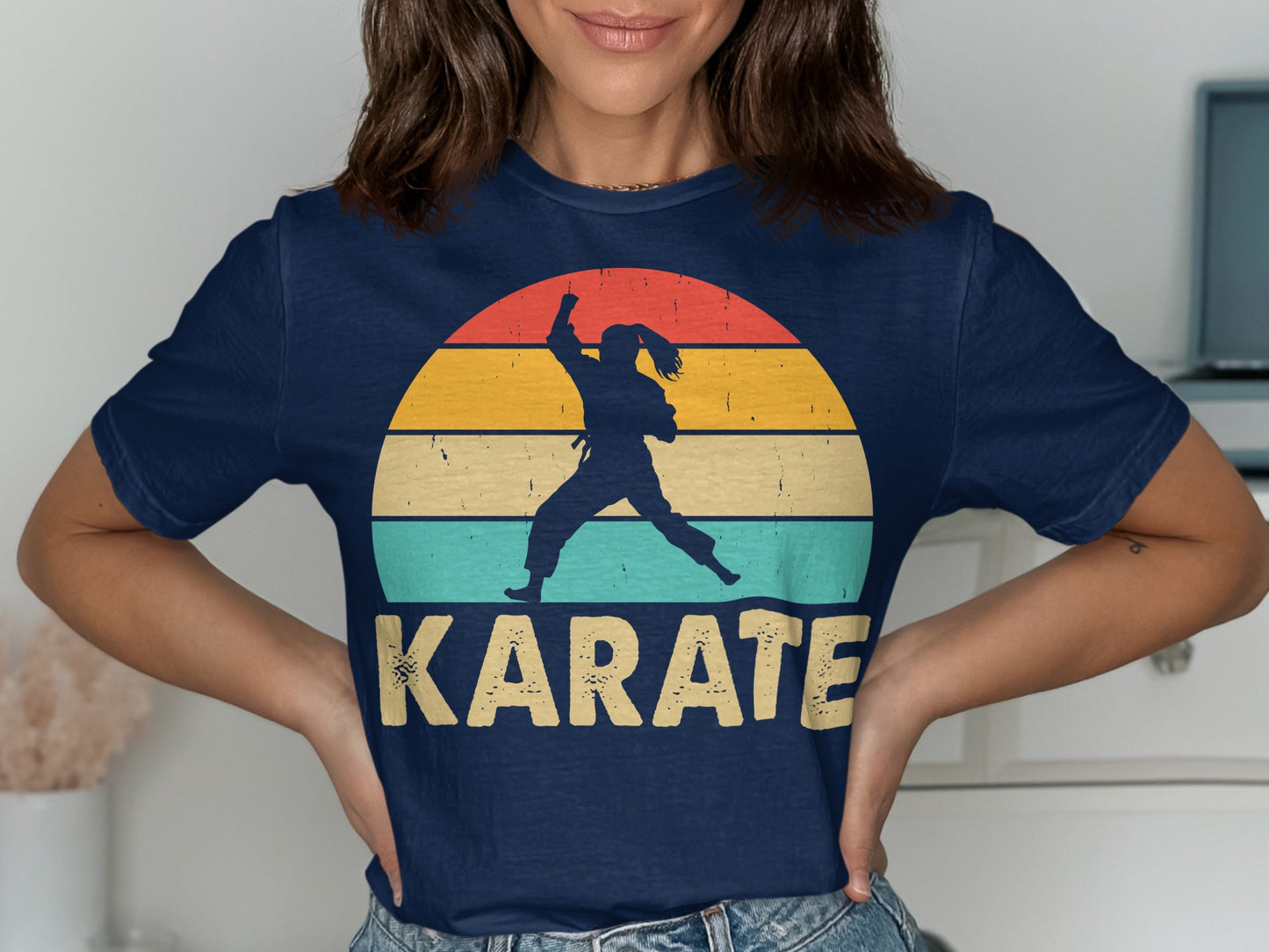 Navy t-shirt with a silhouette of a karate practitioner against a colorful sunset graphic.