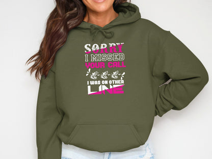 Olive green hoodie with "Sorry I missed your call, I was on other line" text.