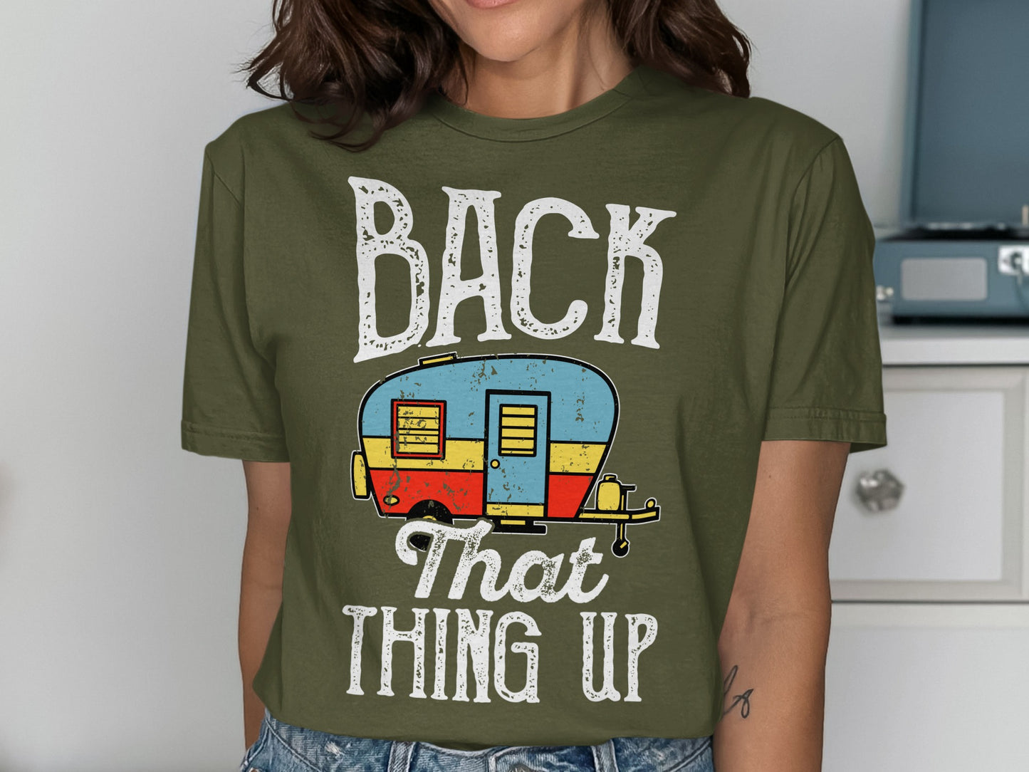 Green t-shirt with "BACK That THING UP" and a cartoon camper.