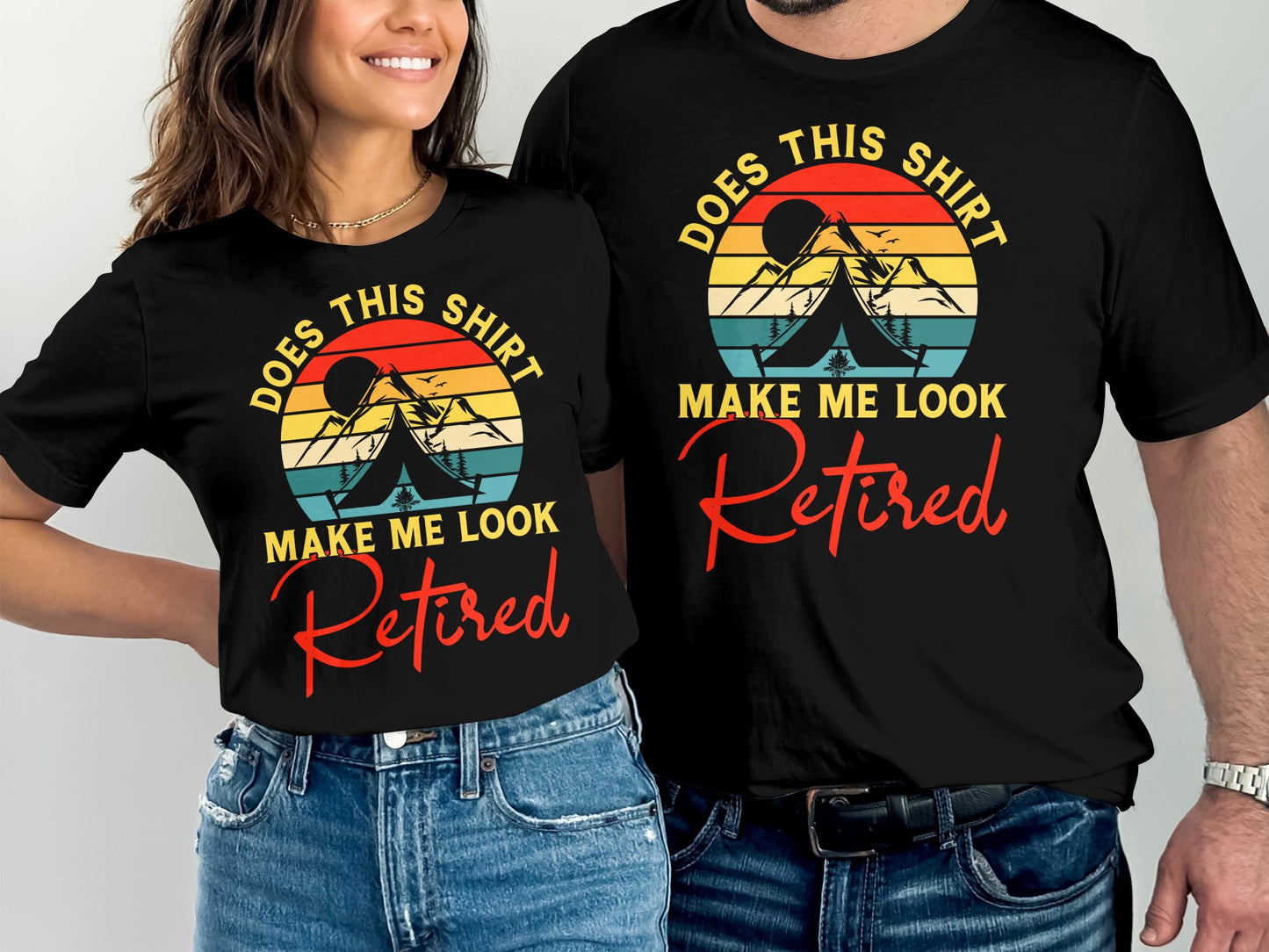 Couple wearing matching t-shirts with mountain sunset graphic and "Retired" text.