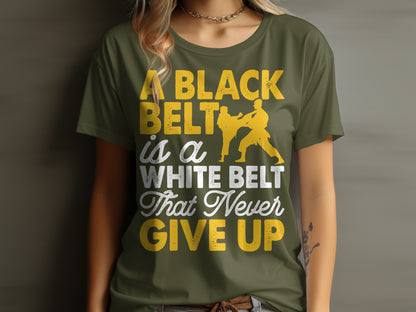 Green t-shirt with yellow text: "A black belt is a white belt that never give up".