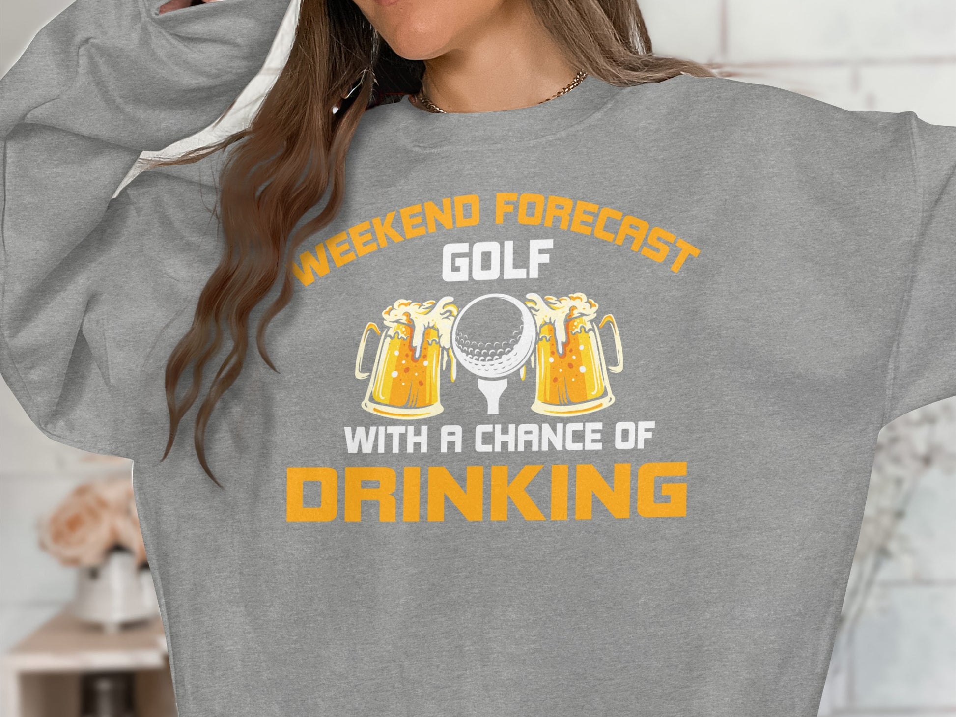 Gray sweatshirt with "Weekend forecast golf with a chance of drinking" text and beer mugs.