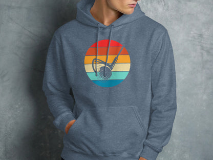 Vintage golf ball and club logo on a heather blue hoodie.