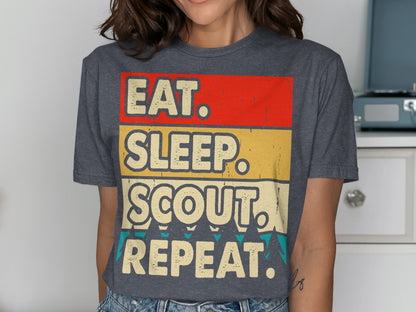 Grey t-shirt with "Eat. Sleep. Scout. Repeat." in red, yellow, and blue text.