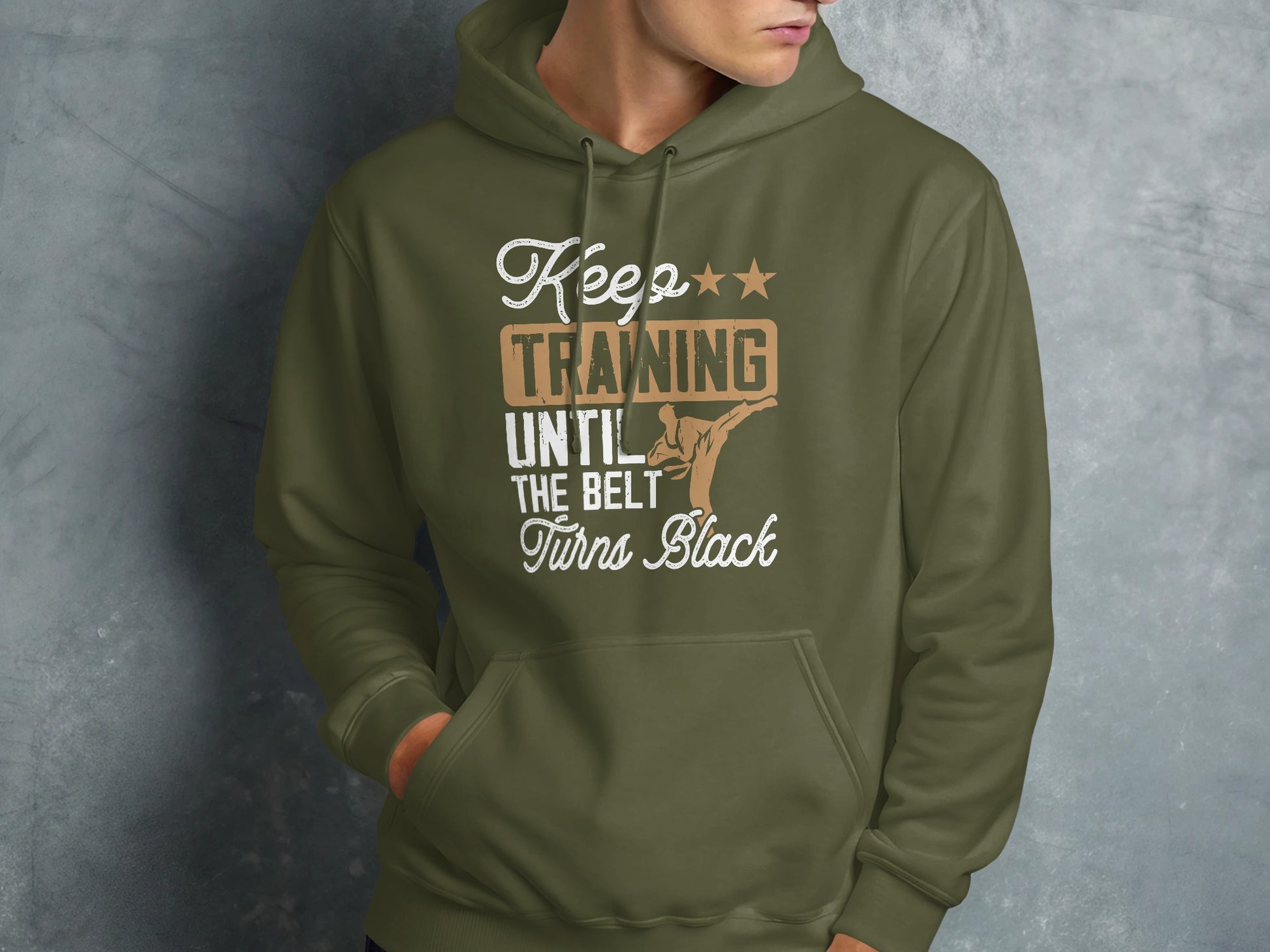 Olive green hoodie with "Keep Training Until The Belt Turns Black" text and karate graphic.