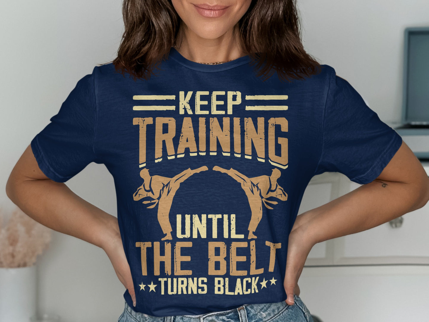 Navy t-shirt with "Keep Training Until the Belt Turns Black" and martial arts figures.