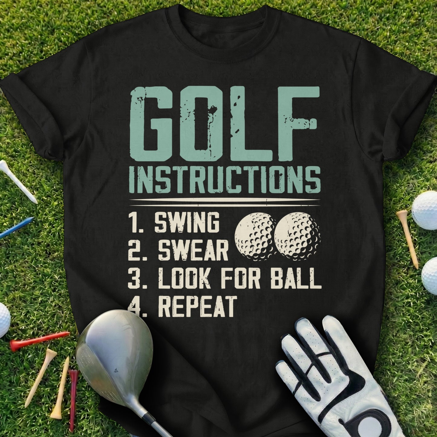Black t-shirt with "GOLF INSTRUCTIONS" and numbered steps: swing, swear, look for ball, repeat.