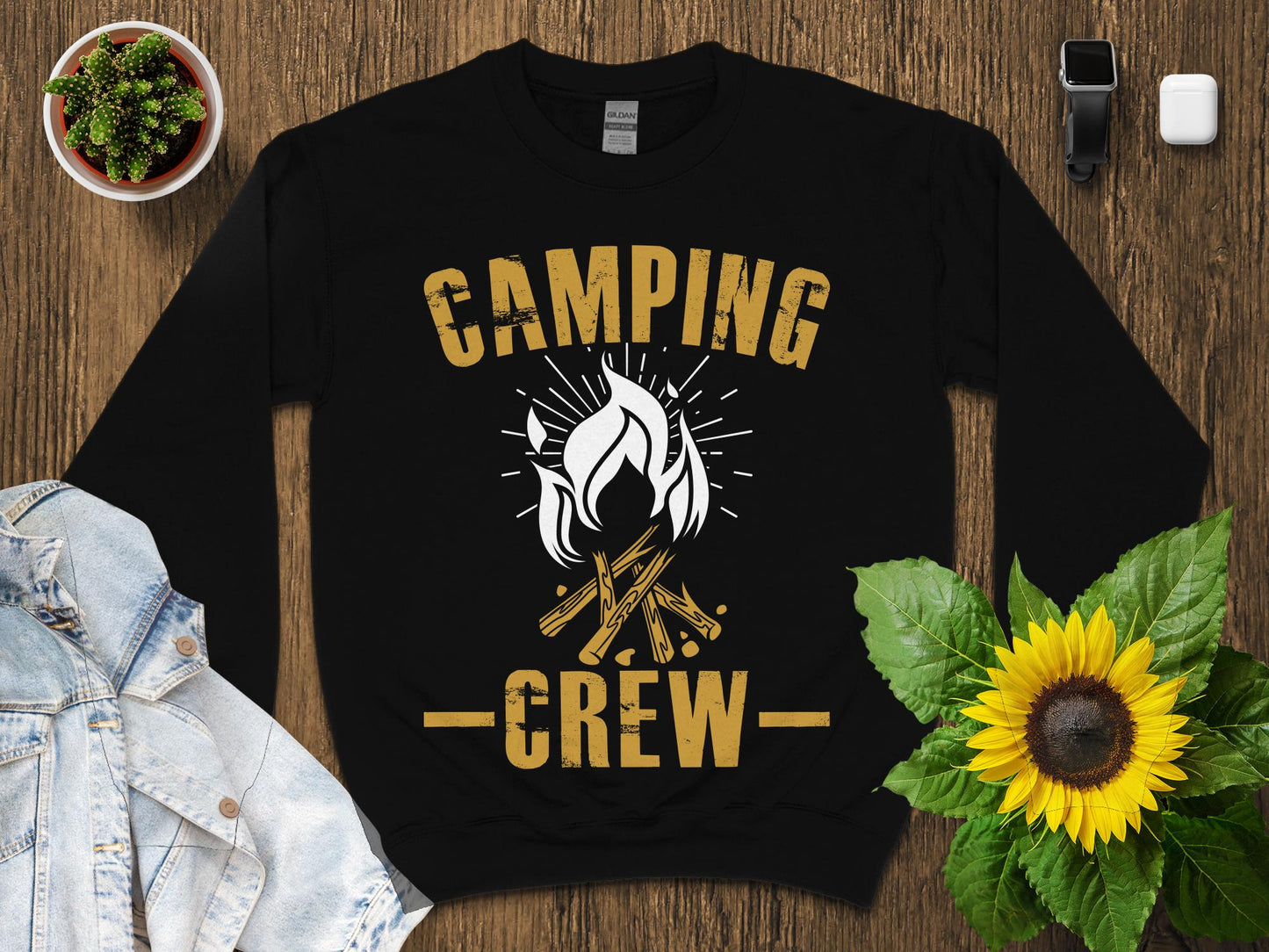 Black sweatshirt with "Camping Crew" text and campfire graphic.