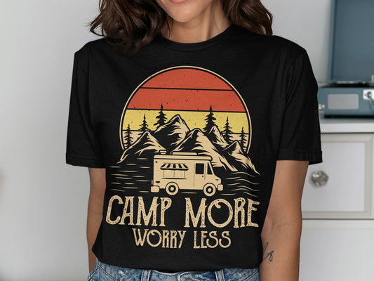 Camper van and mountains graphic with "CAMP MORE WORRY LESS" text.