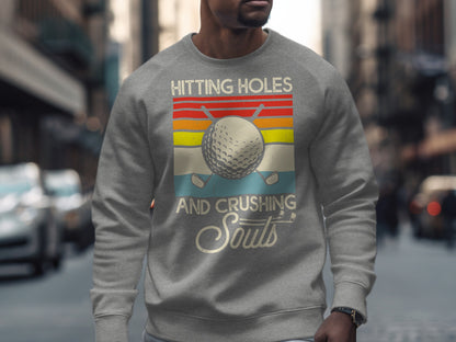 Gray sweatshirt with a vintage golf design: "Hitting Holes And Crushing Souls".