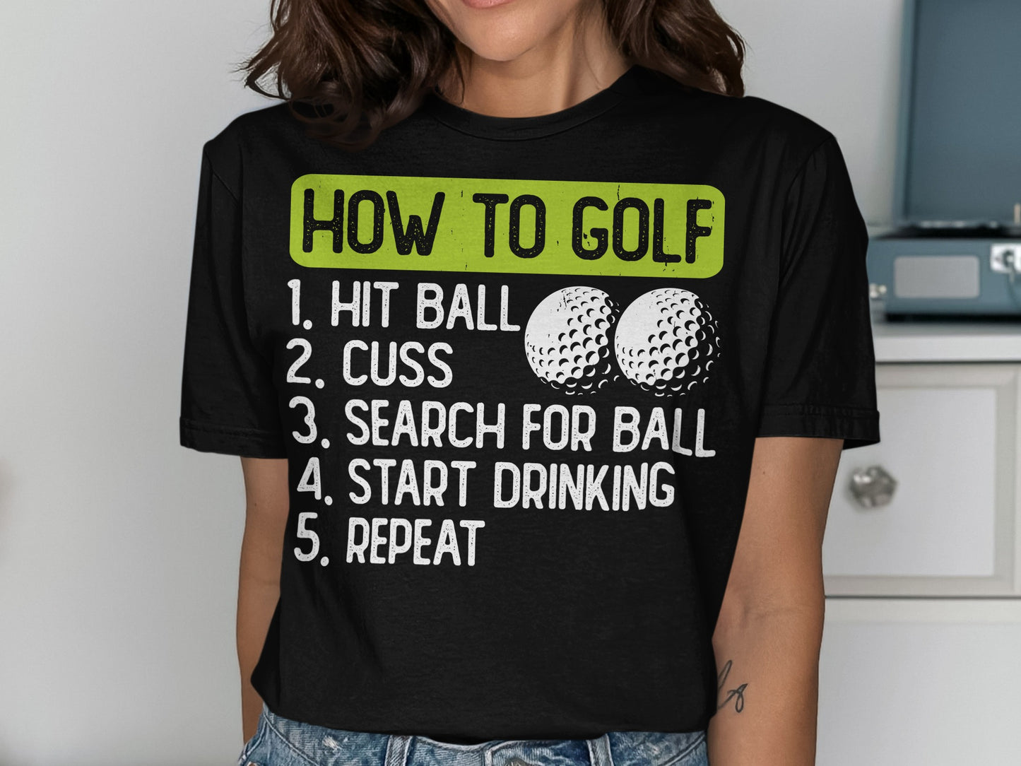 T-shirt with "How to Golf" and humorous steps including "Hit Ball" and "Start Drinking."