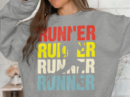Runner graphic sweatshirt with running silhouette on gray fabric.