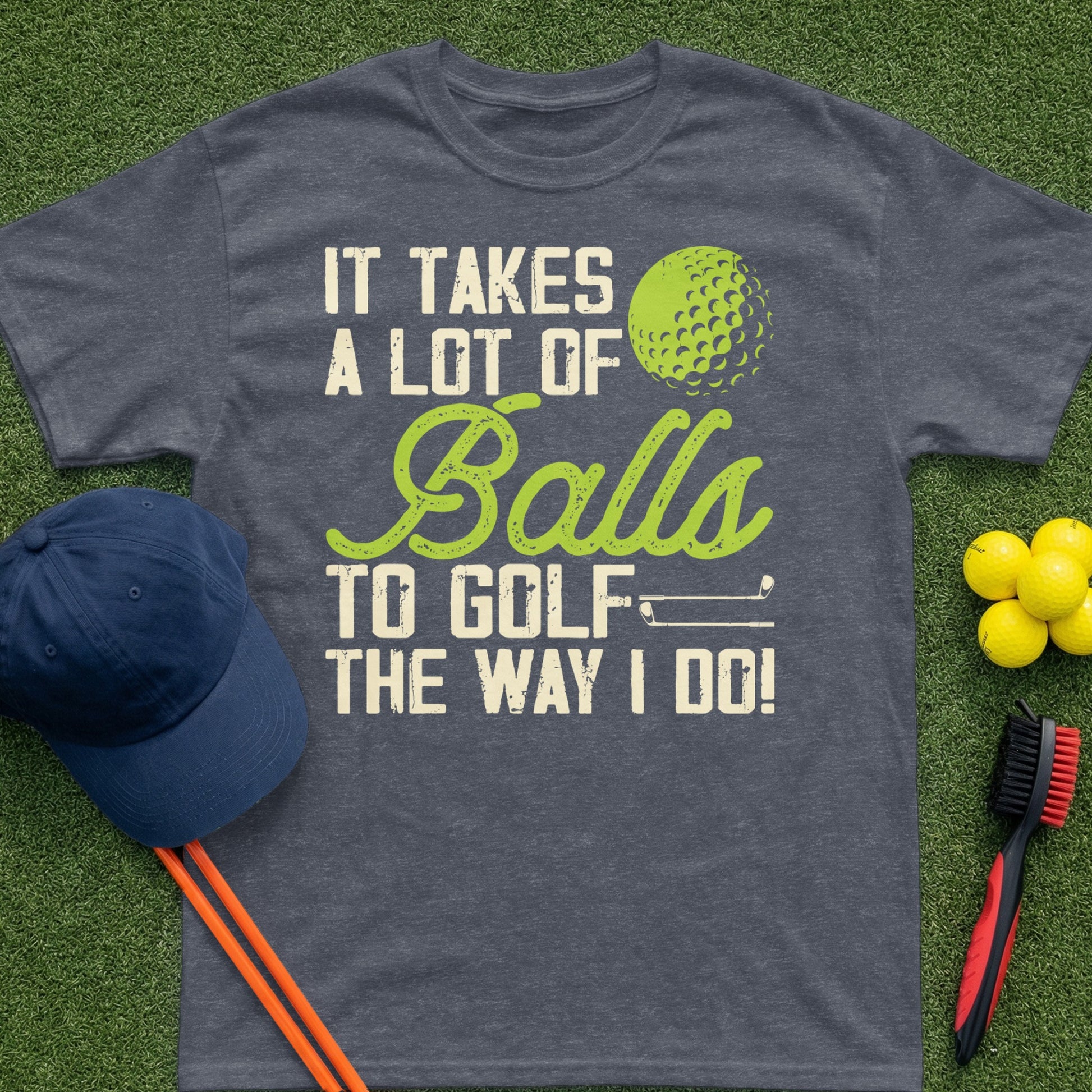Dark gray t-shirt with "It Takes A Lot Of Balls To Golf The Way I Do!" text and golf ball graphic.