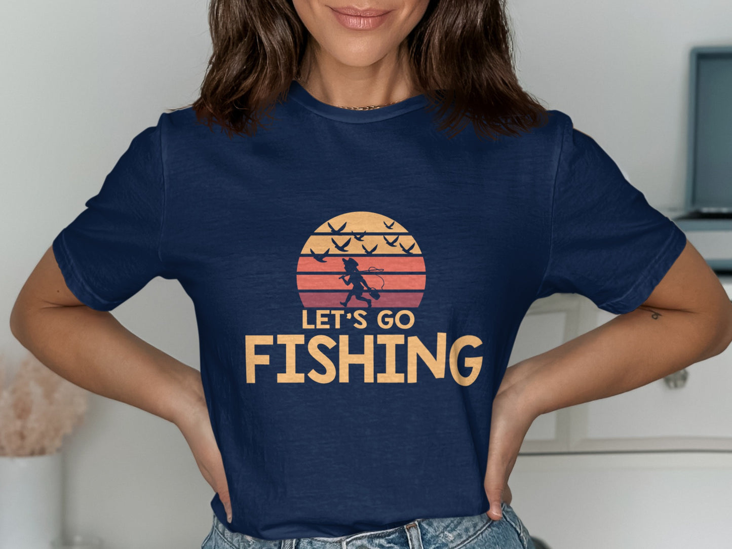 Navy t-shirt with "LET'S GO FISHING" in orange text and a sunset graphic.