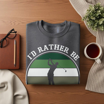 Dark gray sweatshirt with "I'd rather be golfing" graphic and golfer silhouette.