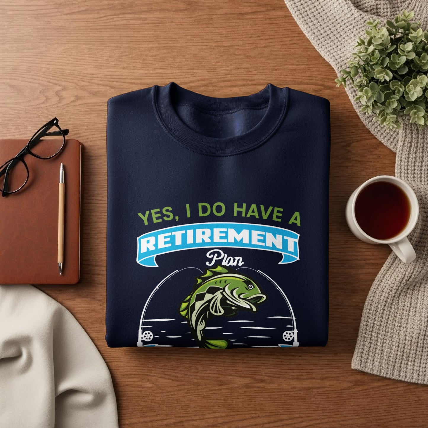 Navy sweatshirt with "Yes, I Do Have a Retirement Plan" and a fishing graphic.