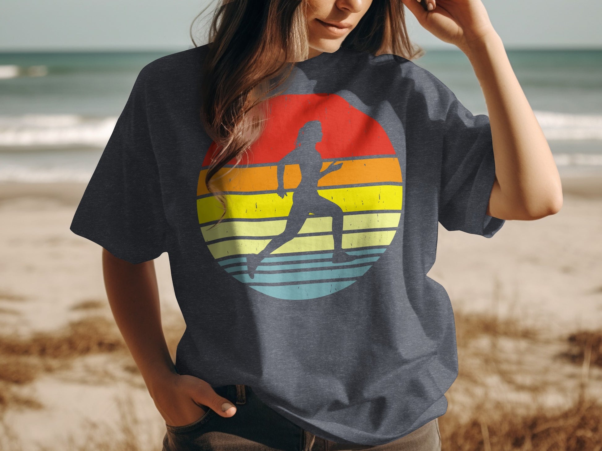Runner silhouette within a colorful striped sunset on a dark t-shirt.