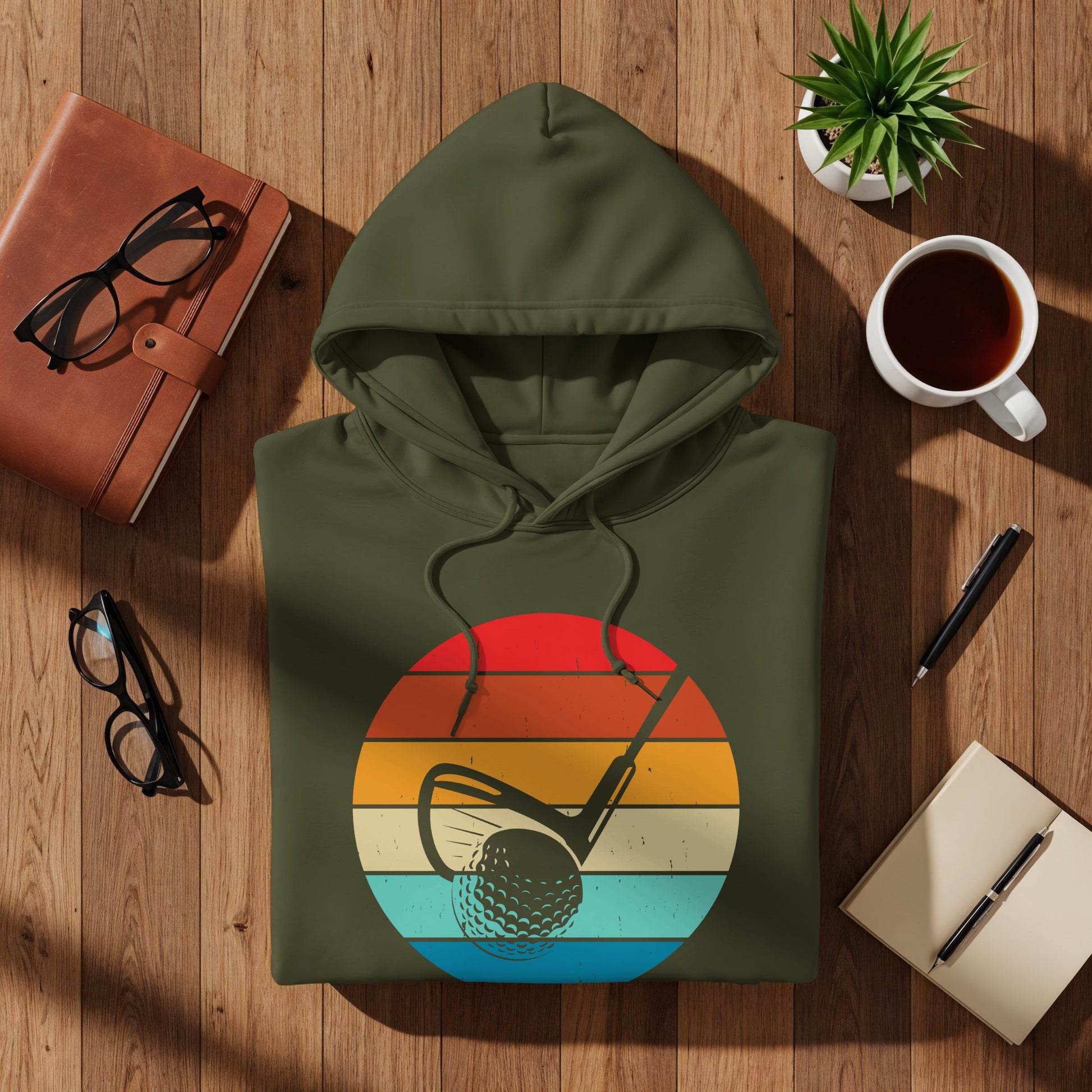 Green hoodie with a retro golf sunset design.