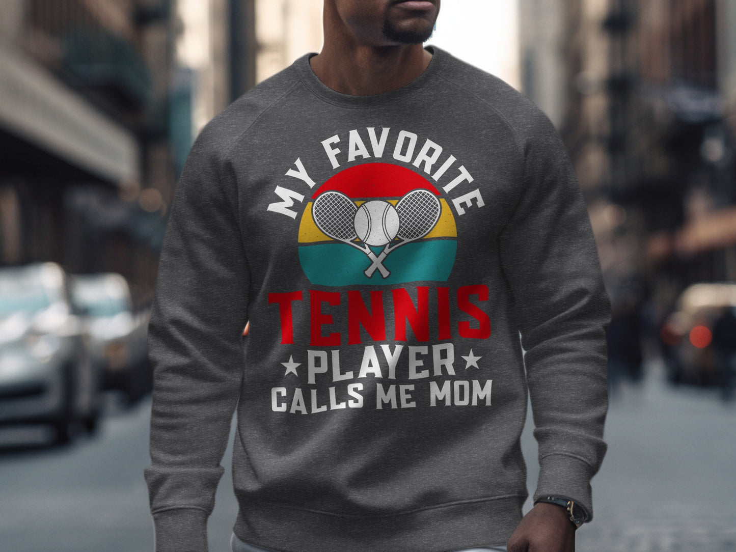Crewneck sweatshirt with "My Favorite Tennis Player Calls Me Mom" text and crossed racquets.