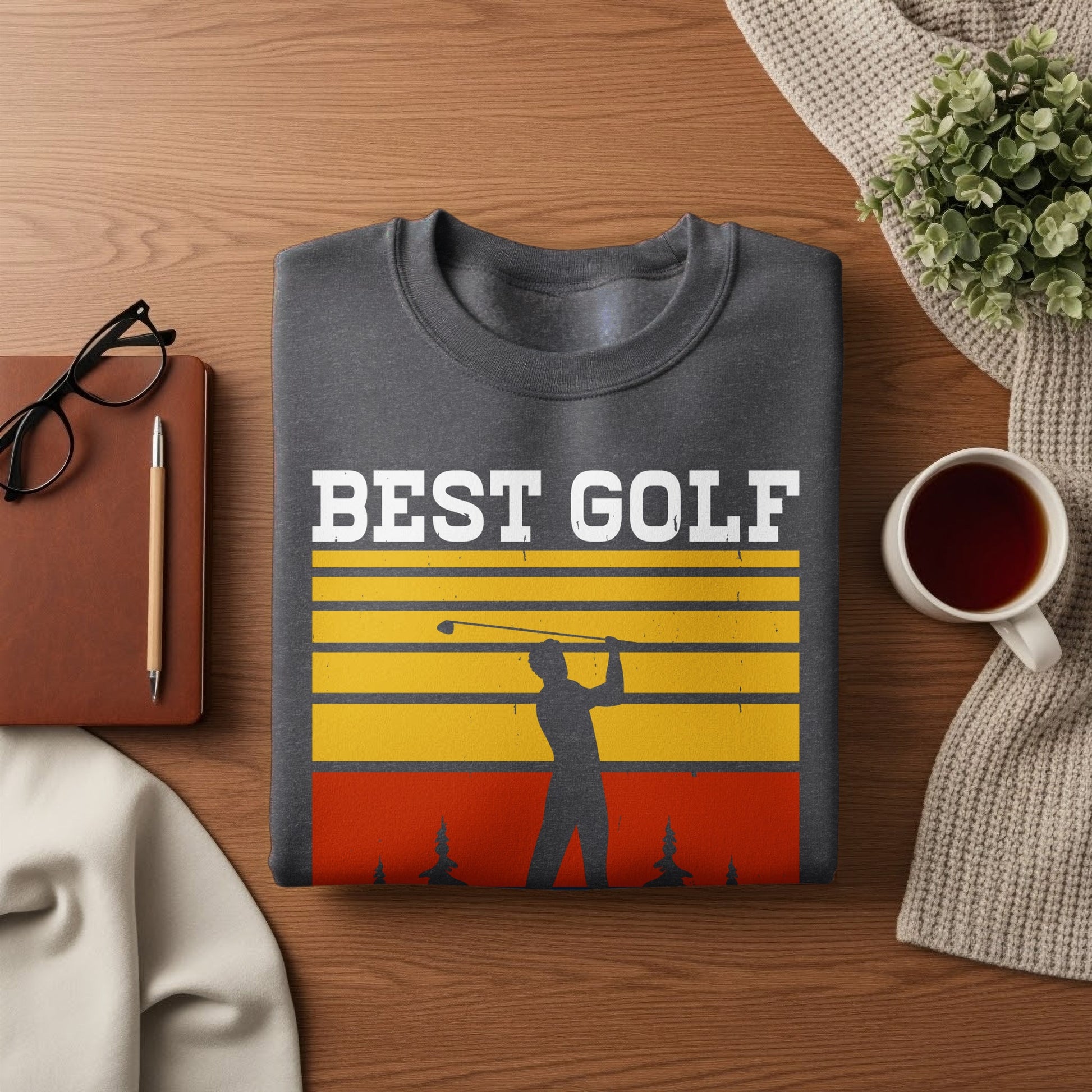 Dark gray sweatshirt with "BEST GOLF" text and golfer silhouette against striped background.