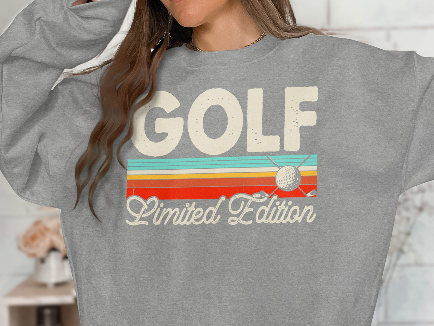 Gray sweatshirt with "GOLF Limited Edition" text and vintage golf graphics.