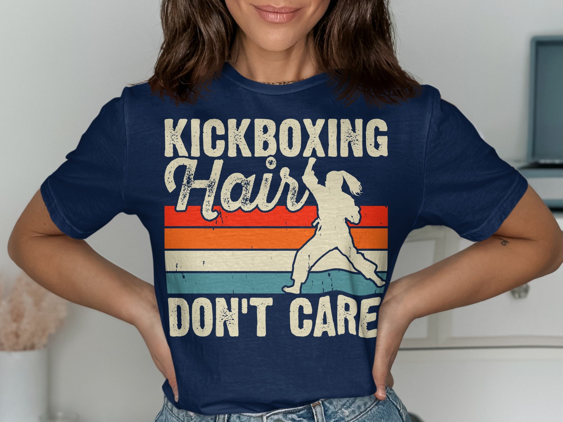 Navy t-shirt with "Kickboxing Hair Don't Care" and silhouette of a kickboxer.