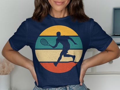 Navy t-shirt with retro tennis player graphic and striped circle.