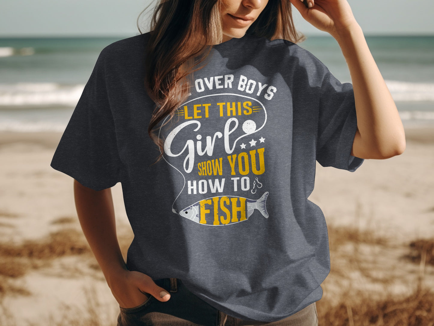 Woman wearing dark grey t-shirt with "Let this girl show you how to fish" text.