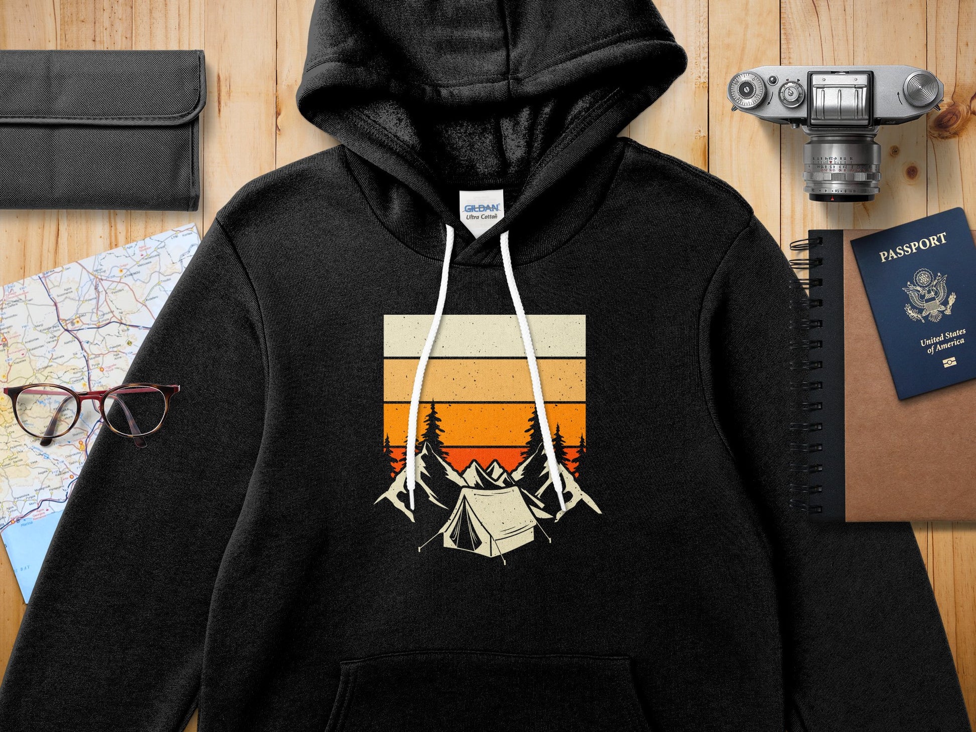 Black Gildan Ultra Cotton hoodie with a vintage camping graphic.