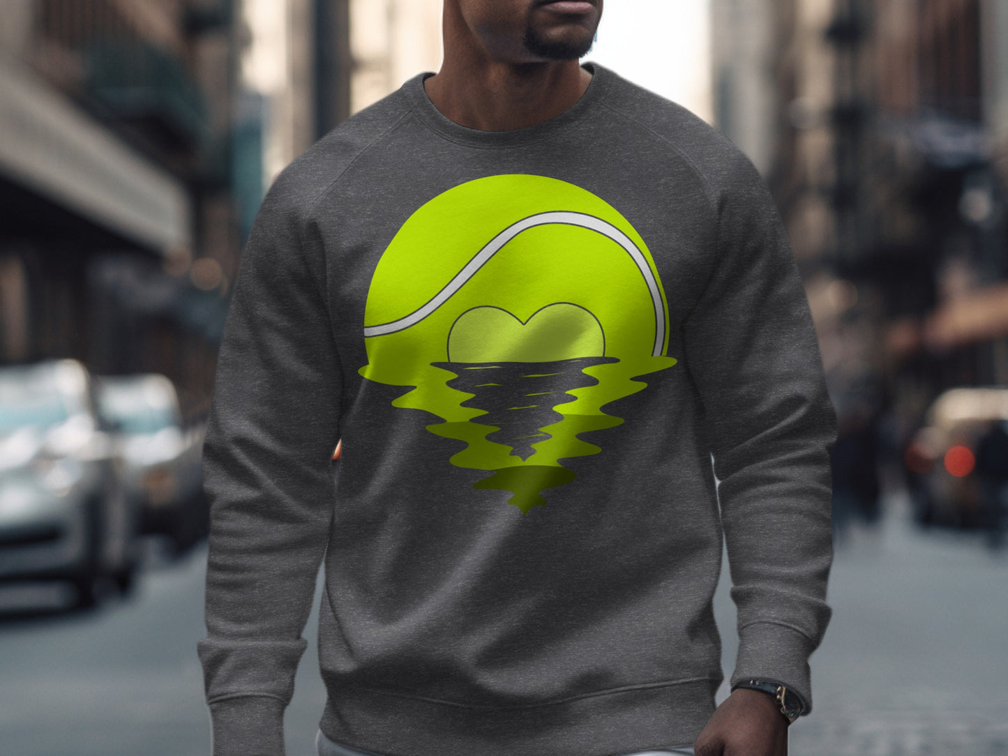 Gray sweatshirt featuring a tennis ball with a heart-shaped reflection.