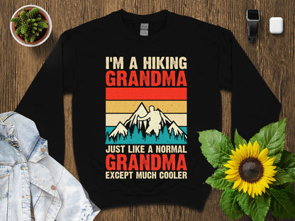 Black sweatshirt with retro graphic: "I'm a hiking grandma, just like a normal grandma except much cooler."