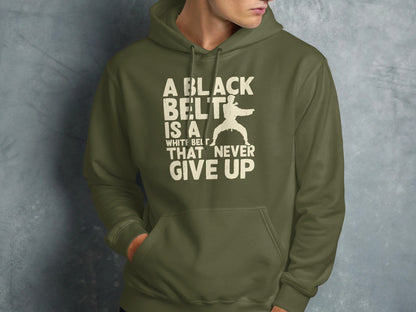Green hoodie with "A black belt is a white belt that never give up" text and karate silhouette.