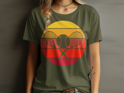 Retro tennis graphic with crossed rackets and balls on a green t-shirt.