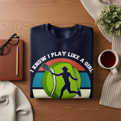 Navy sweatshirt with tennis ball and player graphic, "I Know I Play Like A Girl" text.