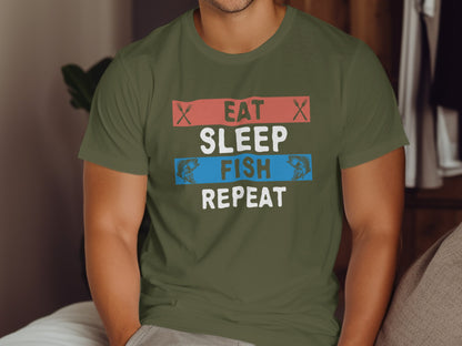Olive green t-shirt with "Eat Sleep Fish Repeat" text and fish graphics.