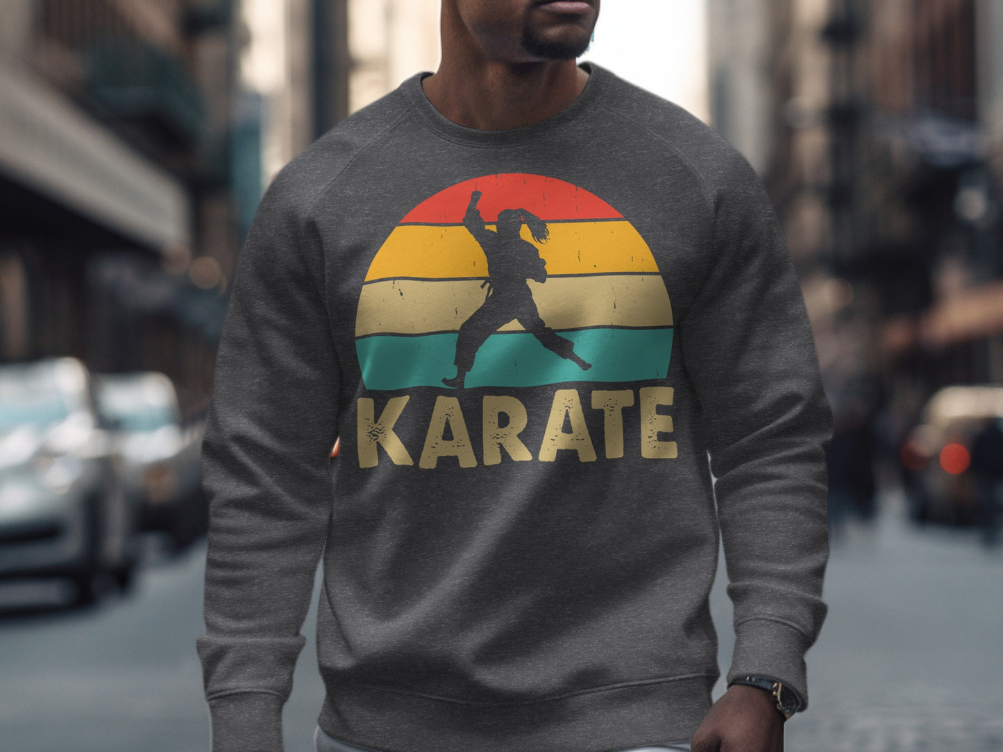 Gray sweatshirt with a silhouette of a karate fighter within a colorful sunset circle.
