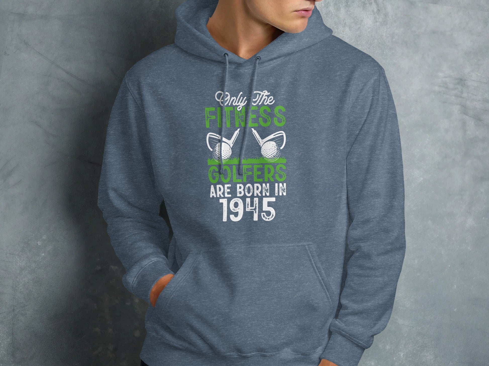 Gray hoodie with "Only the fitness golfers are born in 1945" and golf balls.