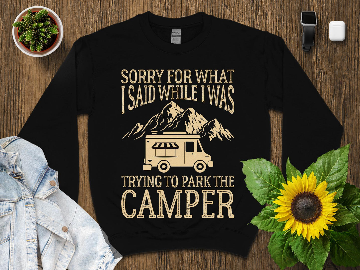 Black sweatshirt with "Sorry for what I said while trying to park the camper" text and graphics.