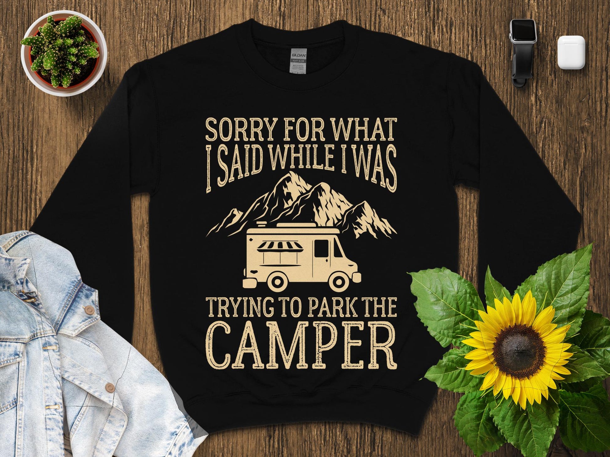 Black sweatshirt with "Sorry for what I said while trying to park the camper" text and graphics.