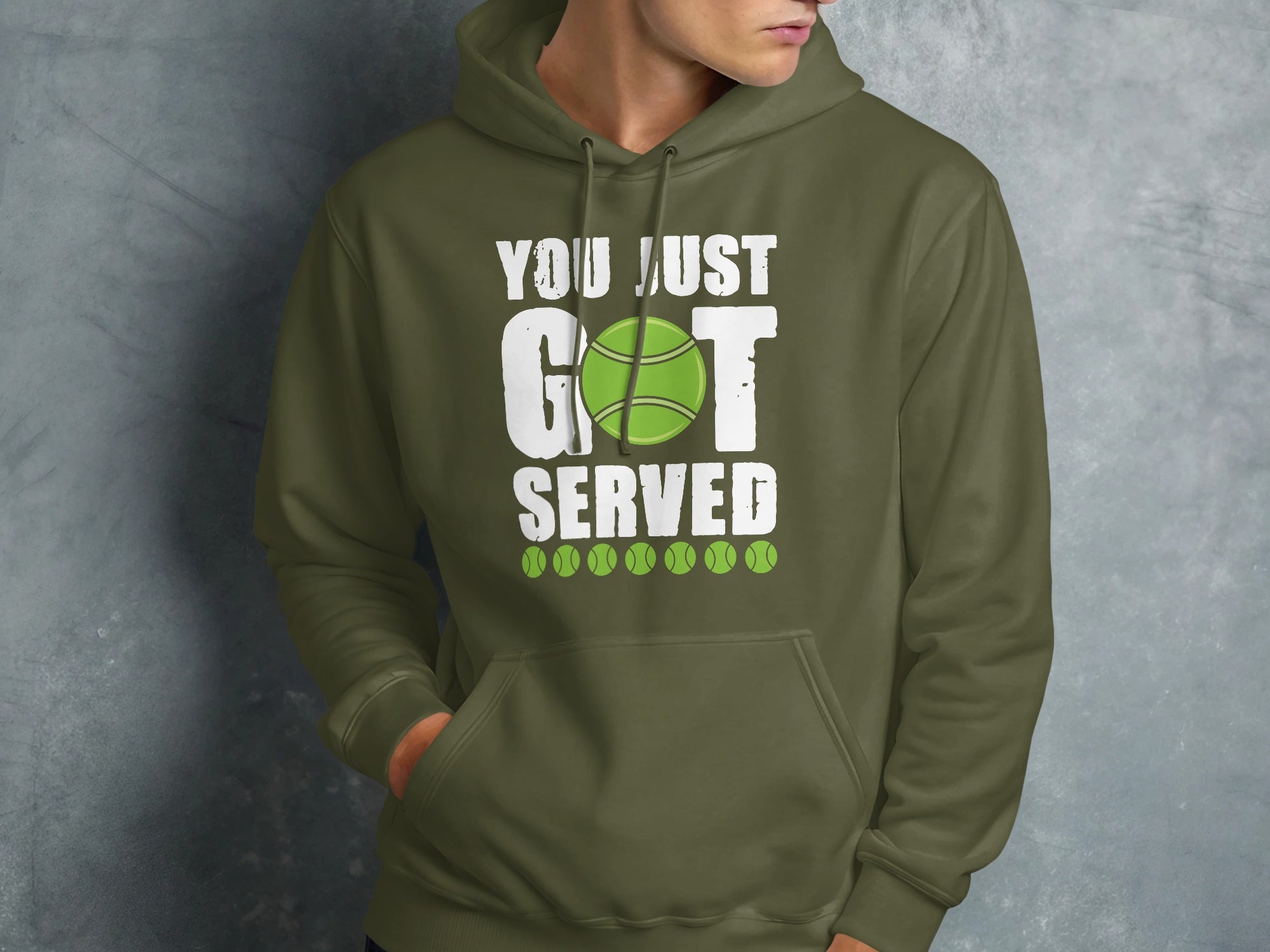 Olive green hoodie with "You Just Got Served" text and tennis balls graphic.