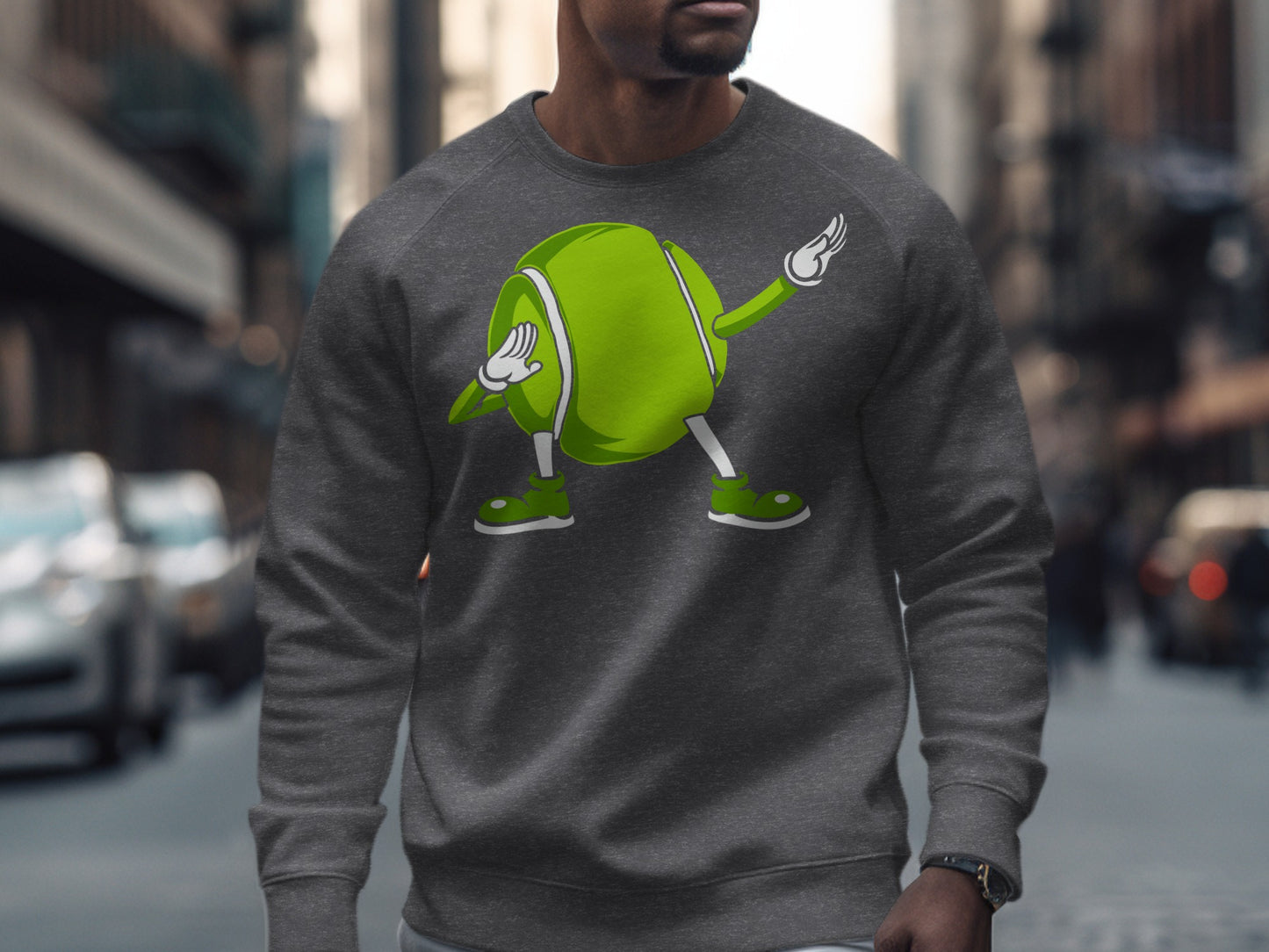 Dark grey sweatshirt with a cartoon tennis ball character dabbing.
