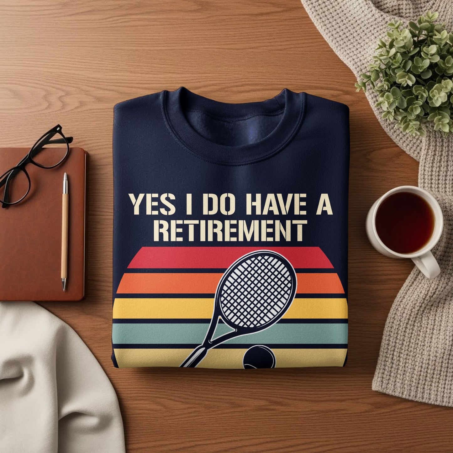 Navy sweatshirt with "YES I DO HAVE A RETIREMENT" text and tennis graphic.