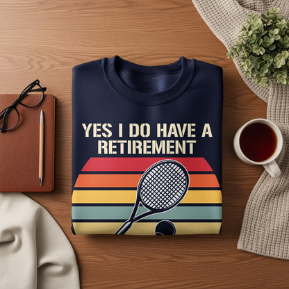 Navy sweatshirt with "YES I DO HAVE A RETIREMENT" text and tennis graphic.