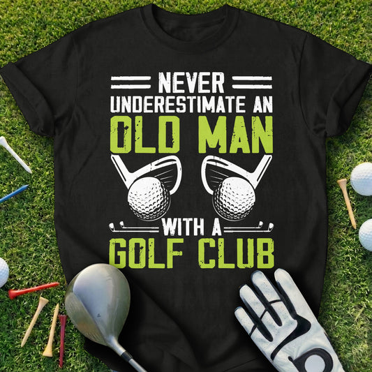 Black t-shirt with "Never Underestimate an Old Man With a Golf Club" text and golf imagery.